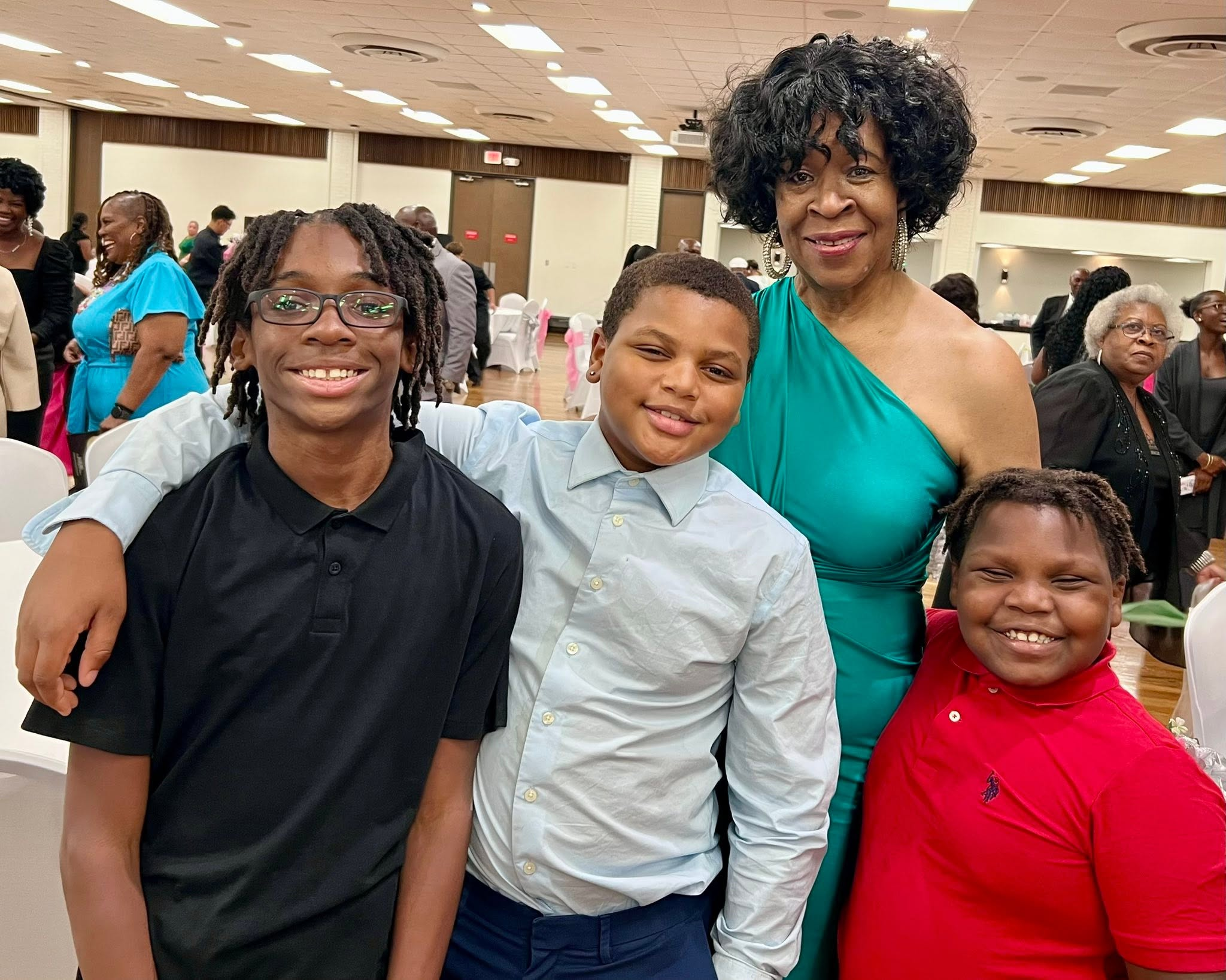 Children and a community member together at a community event